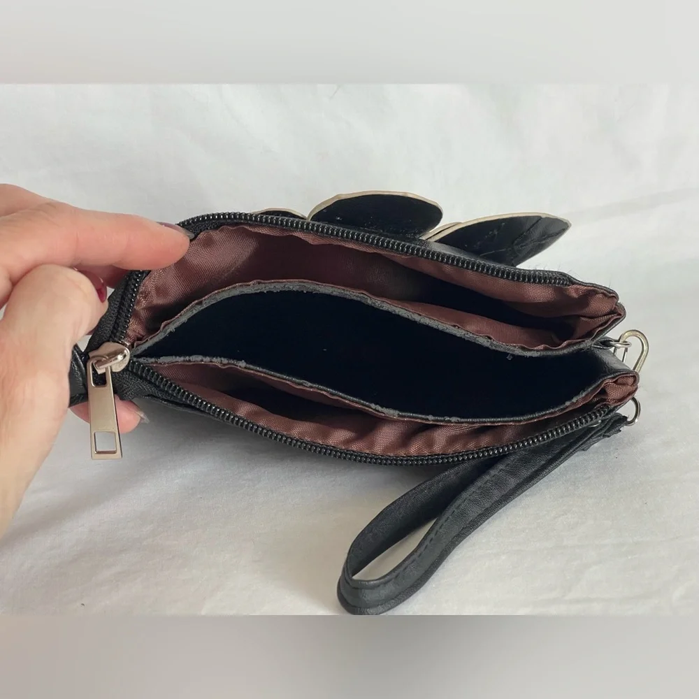 Fun little black faux, leather clutch wristlet three pocket with a zipper